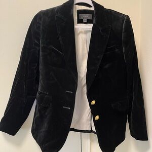 Black velvet jacket with two golden buttons